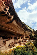 Colorado: Mesa Verde National Park, Cliff Palace (Anasazi ruins from mid 13th century) in cave under mesa of sandstone and shale with streaks of “desert varnish,” October