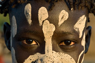 Lebuk, a Karo village, boy with face paint during dancing ceremony