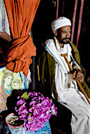 Rock-hewn 13th-century Coptic Christian Church, priest inside Bete Emanuel