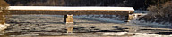 Covered bridge over Connecticut River in winter, Vermont 