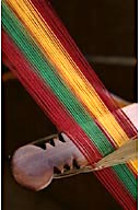 Ghana: Bonwire (Ashanti Region), kente cloth being woven on loom