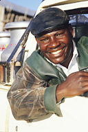 Dairy farmer Mr. Ndirungu, delivering milk in pick-up truck.