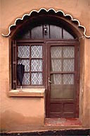 France: Provence, Rousillon, arched doorway with umbrella